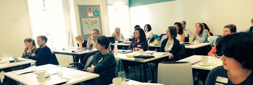 Workshop participants listening to “Flash Presentations” 